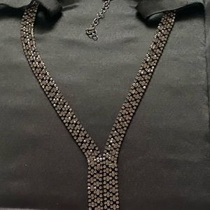 Long necklace with shine grey/black crystals.